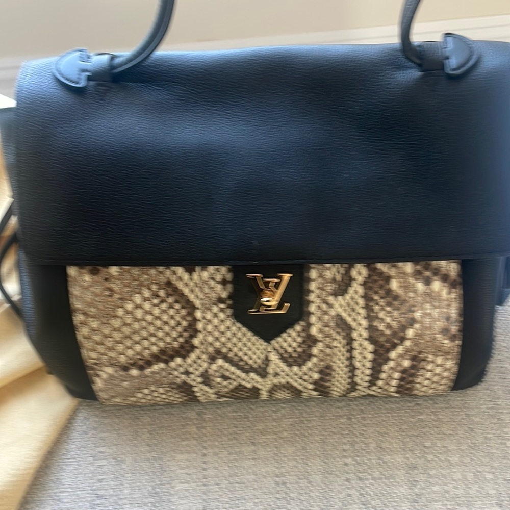 Louis Vuitton lock me black leather bag Python trim has paperwork authentic